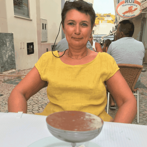 Ashden team member, Suzy Van Den Eynde siting at a table with tiramasu