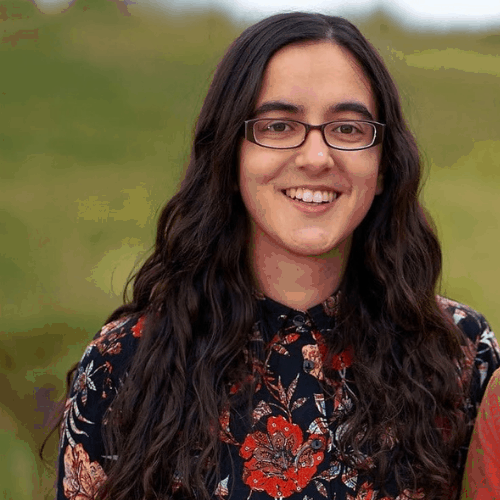 Ashden Team member, Frieda Wignall. a woman wearing glasses and smiling at the camera