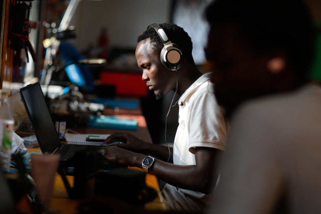 A photo of man working at his computer.